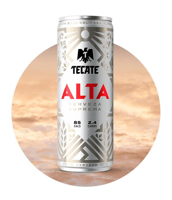 Tecate® Alta, silver can 12fl oz, with Mexican fretwork design. 85 Cals & 2.4 Carbs..
